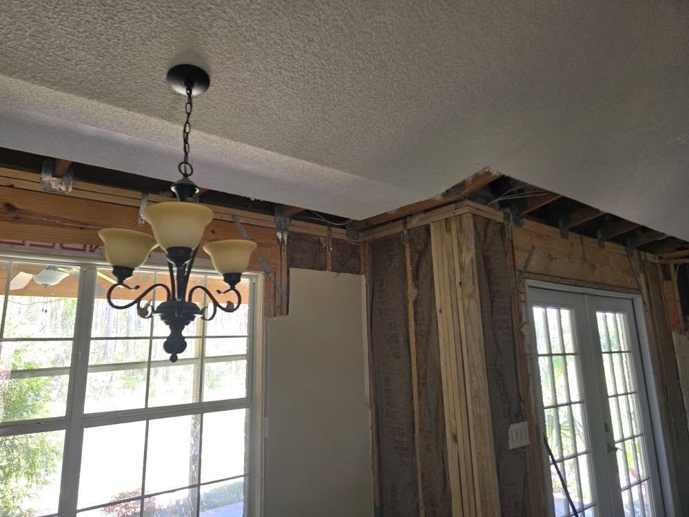 Before: termite damage in interior wall framing in Pensacola